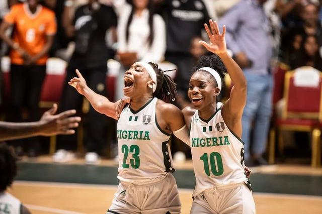 D’Tigress players Ezinne Kalu (#23) and Promise Amukamara (#10) celebrate after winning the 2025 FIBA Women’s AfroBasket championship.